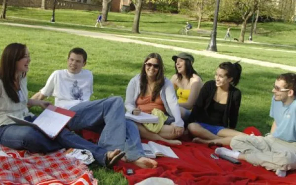 Students sitting on grass