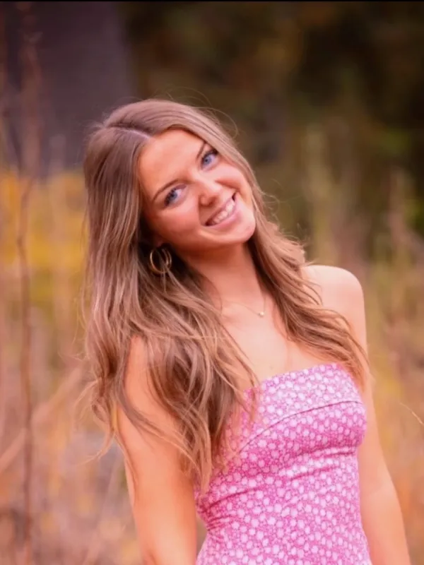 Ella Argy, brown hair, blue eyes, pink dress