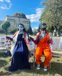 two people dressed up for Muertos